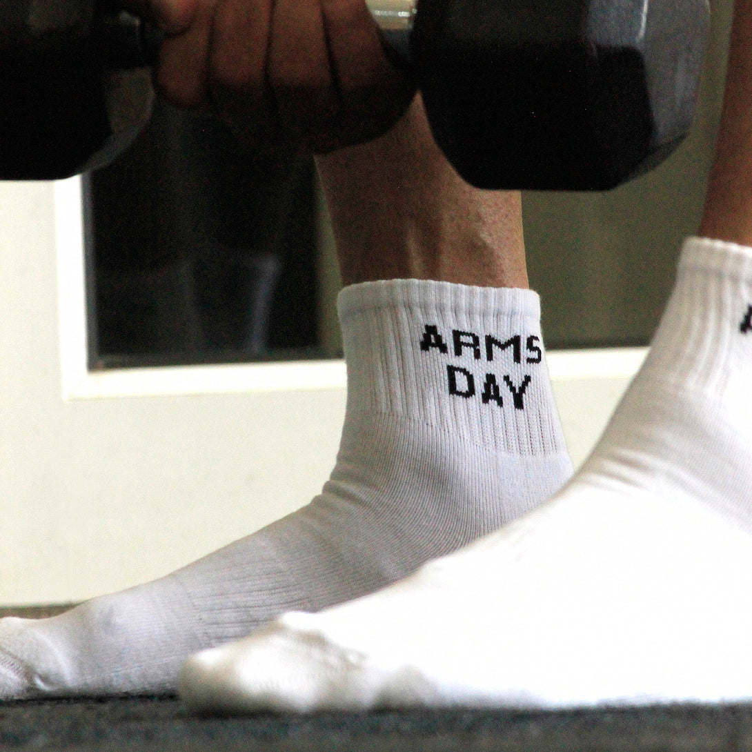 White ankle socks 'arms day' text , soft cotton blend, durable for gym days from The Sock Street.